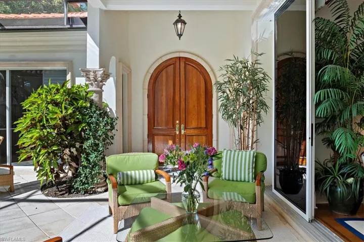 View of exterior entry with stucco siding