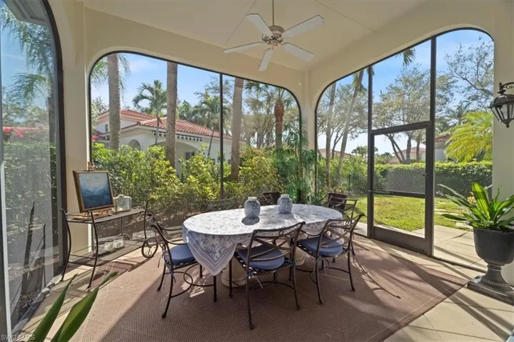 Sunroom / solarium featuring plenty of natural light and a ceiling fan