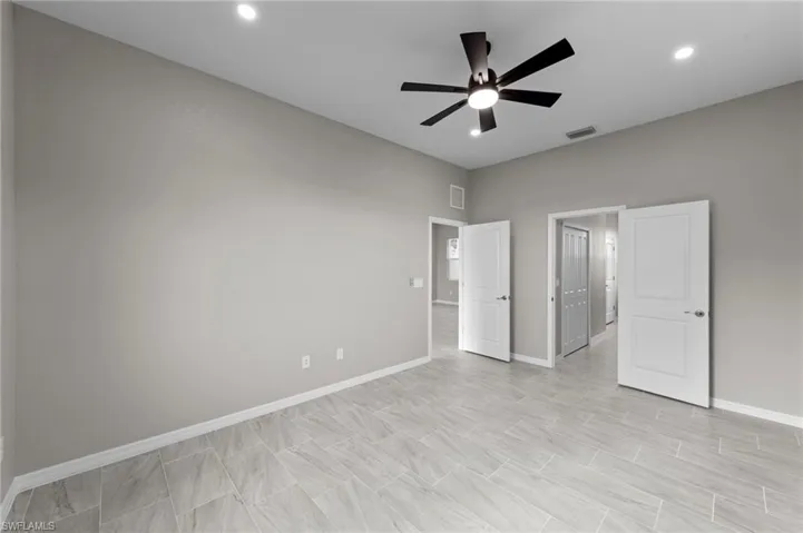 Unfurnished bedroom featuring ceiling fan and recessed lighting