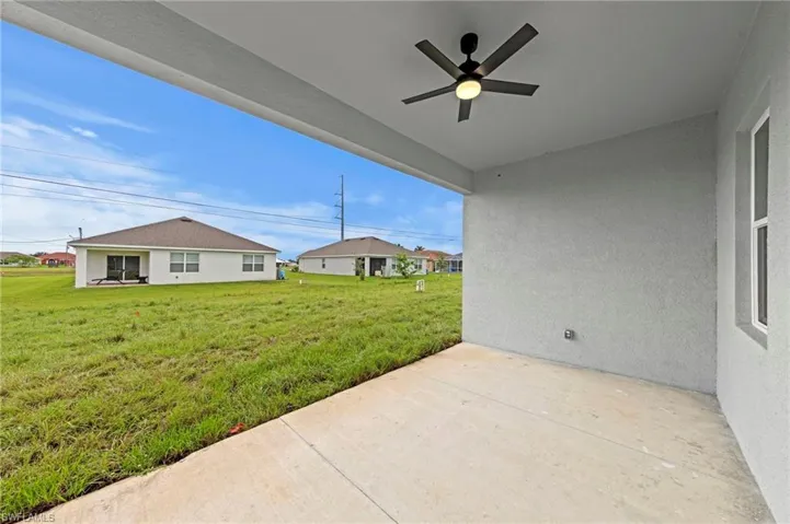View of patio with a ceiling fan