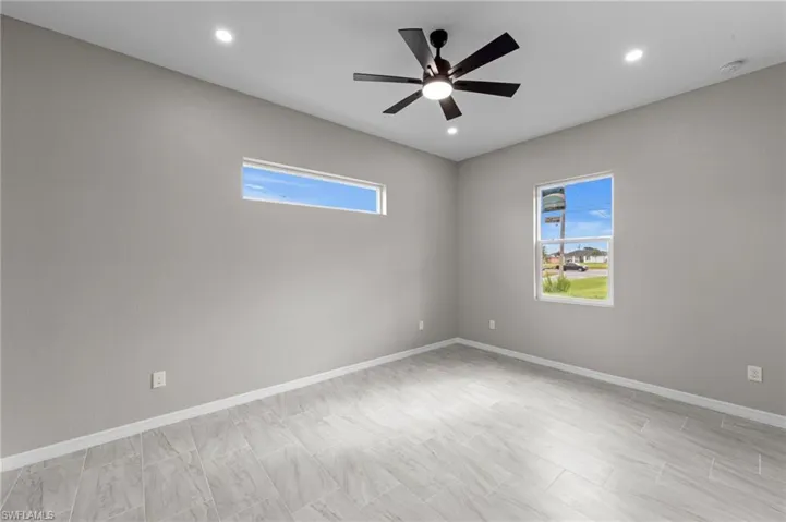 Unfurnished room with recessed lighting and a ceiling fan