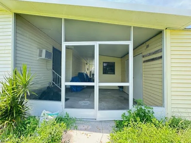 Rear entrance with double screen doors