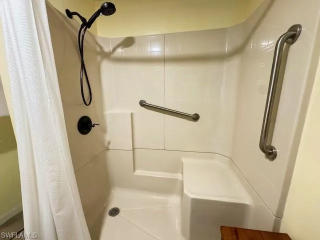 Newer shower insert with bench and safety bars