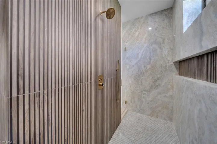 Full bath with a tile shower