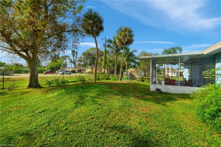 View of yard with a sunroom