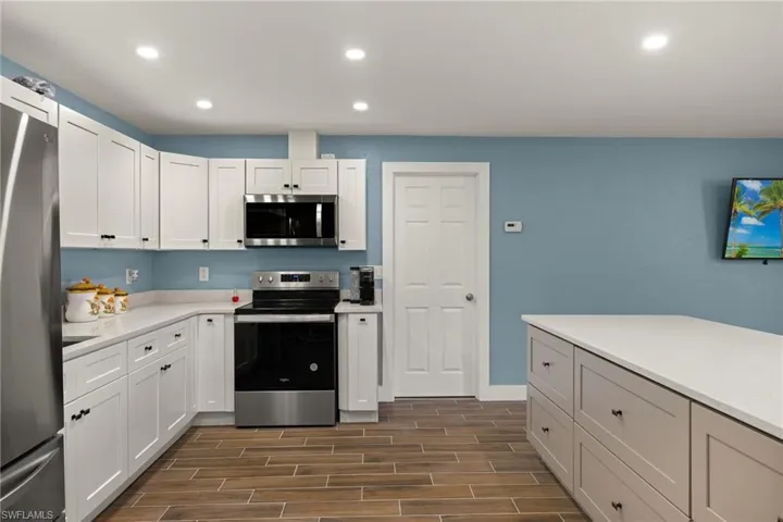 Kitchen with white cabinets and appliances with stainless steel finishes