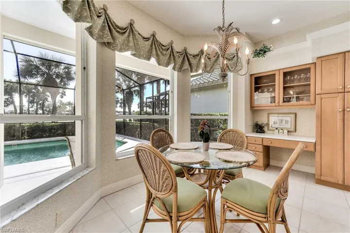 Breakfast area overlooking pool and beautiful golf course and water view