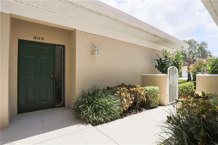Doorway to property with stucco siding