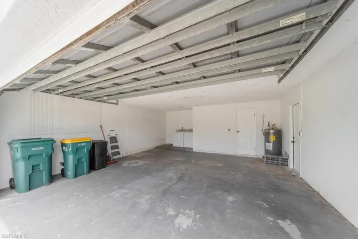 2 Car Garage, door leads to Primary Bathroom, 2nd door leads to backyard.
