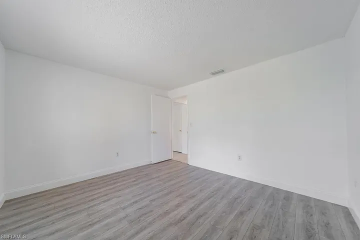 Back Guest bedroom 2, includes blinds, updated LVT flooring