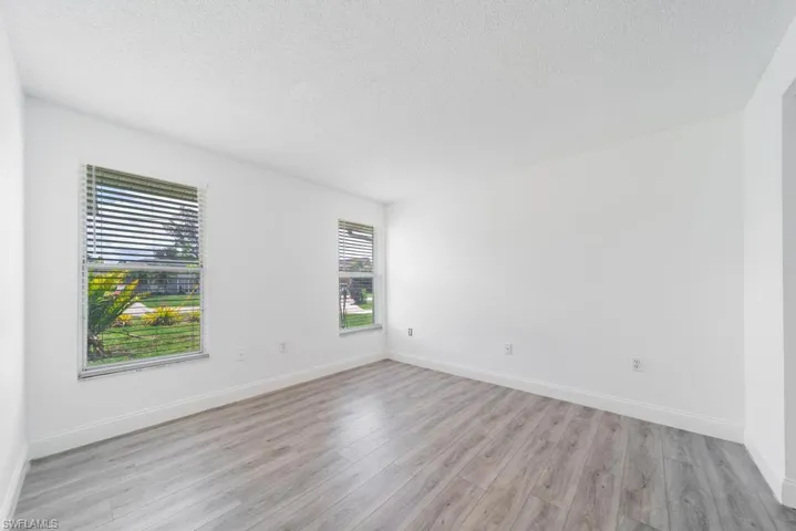 Front Guest bedroom 1, includes blinds, updated LVT flooring
