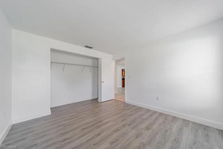 Front Guest bedroom 1, includes blinds, updated LVT flooring