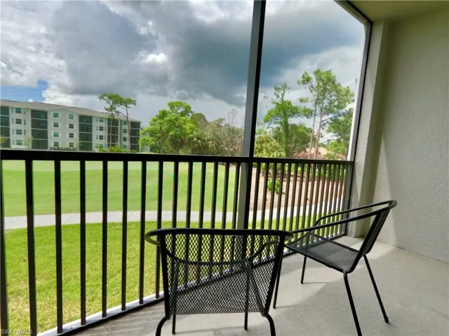 Balcony featuring a sunroom