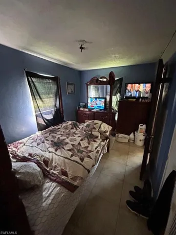 Bedroom with tile floors
