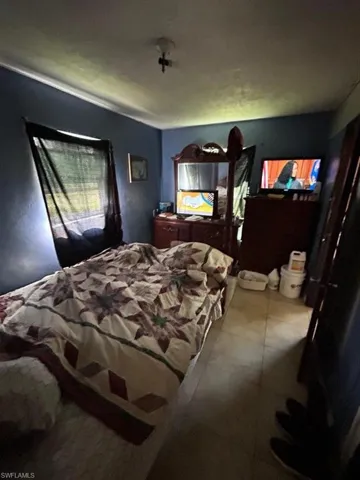 Bedroom featuring tile flooring