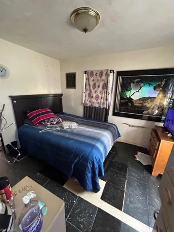 Bedroom with tile flooring