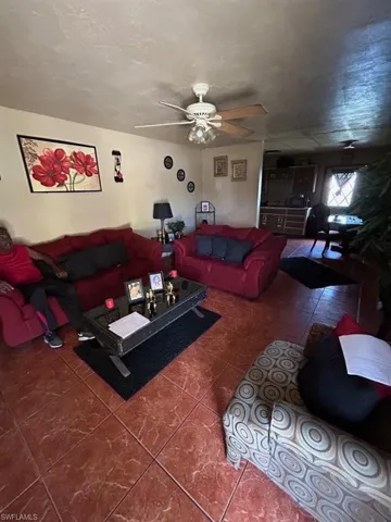 Tiled living room with ceiling fan