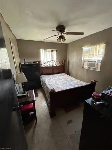 Tiled bedroom with ceiling fan