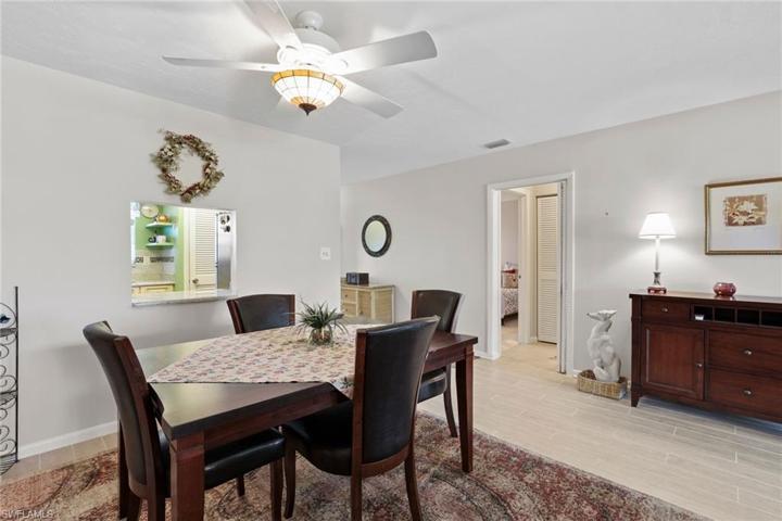 Dining area with pass through to kitchen, and guest bed/bath area through doorway.