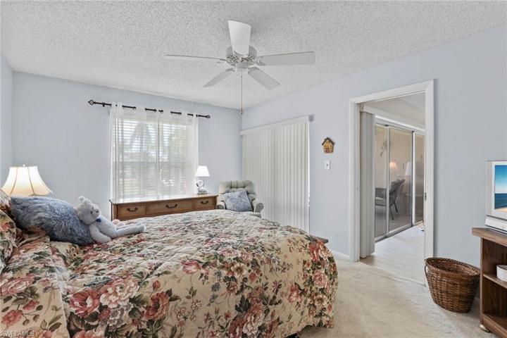 Primary bedroom, slider to lanai.