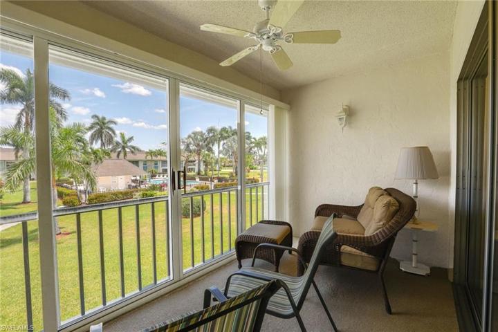 Lanai overlooks landscaped area and pool.