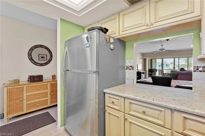 Kitchen pass through to dining area.