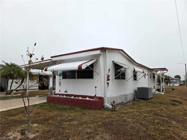 Awnings all around provide storm protection & energy savings.