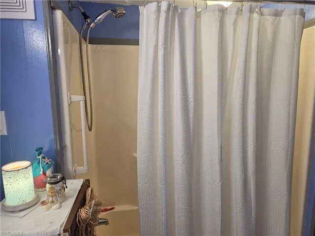 Tub/shower combination with hand-held sprayer.