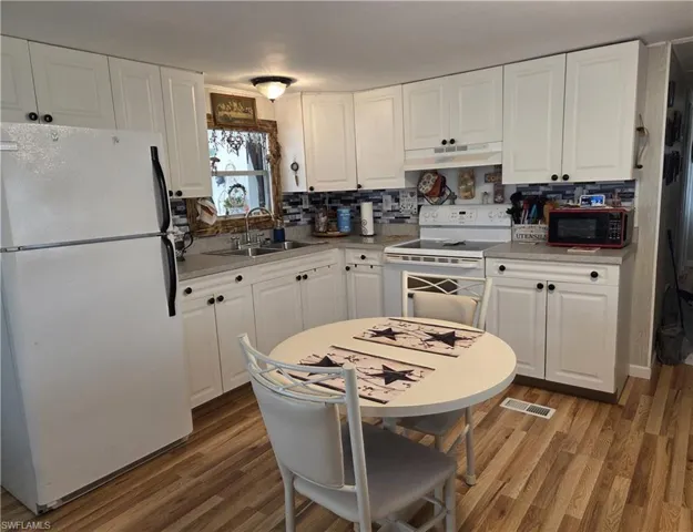 All appliances are included: self-cleaning oven, fridge, & microwave.