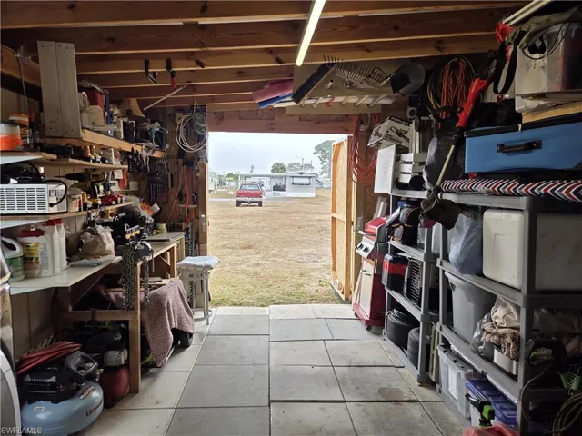 Spacious tool shed has double doors for easy access storing your mower, motorcycle, or golf cart.