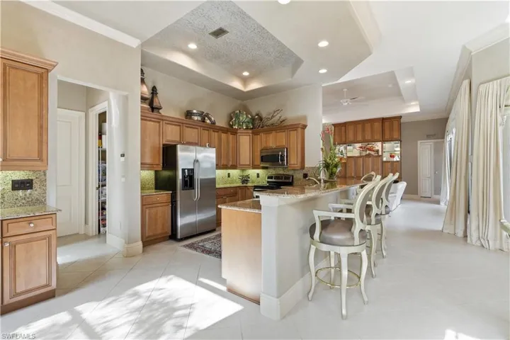 An inviting kitchen with ample cabinetry and stainless steel appliances.