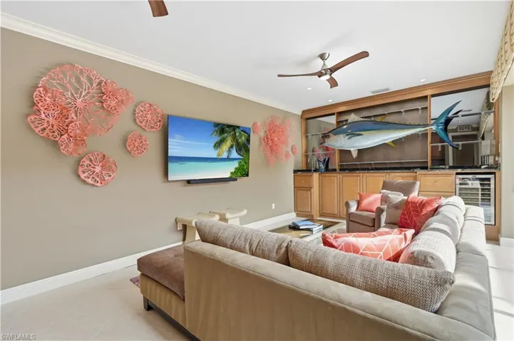 An inviting retreat for watching television or relaxing poolside.
