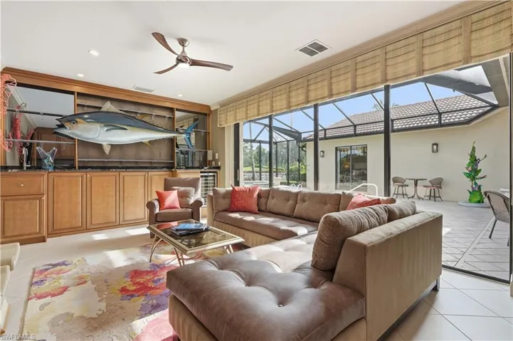 Sliding glass doors provide effortless access to the pool.