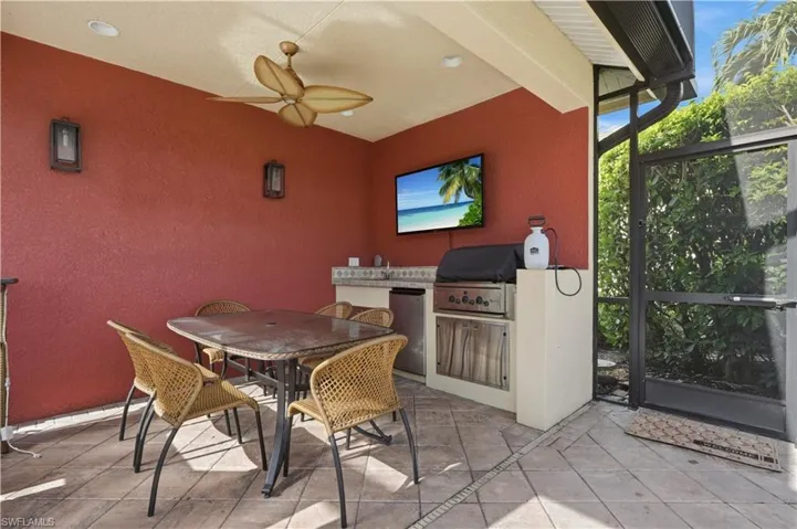 Closeup view of the outdoor dining space, with plenty of shade from the sun.