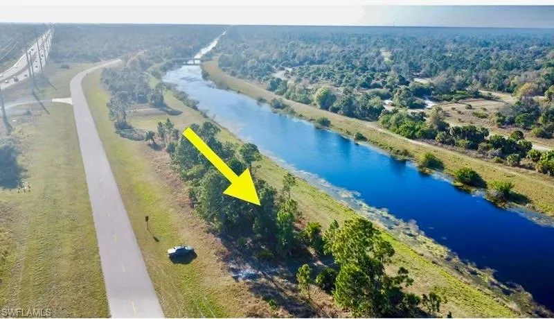 Aerial view of a large body of water and a heavily wooded area