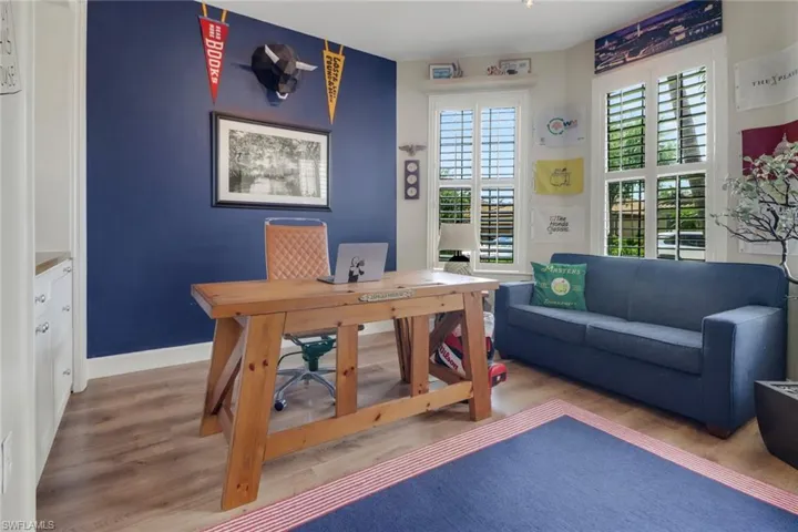 Office area featuring baseboards and wood finished floors