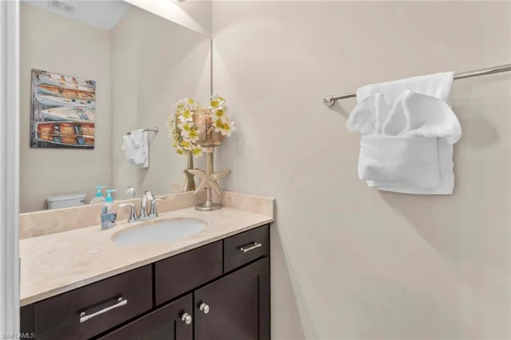 Half bath with vanity and toilet