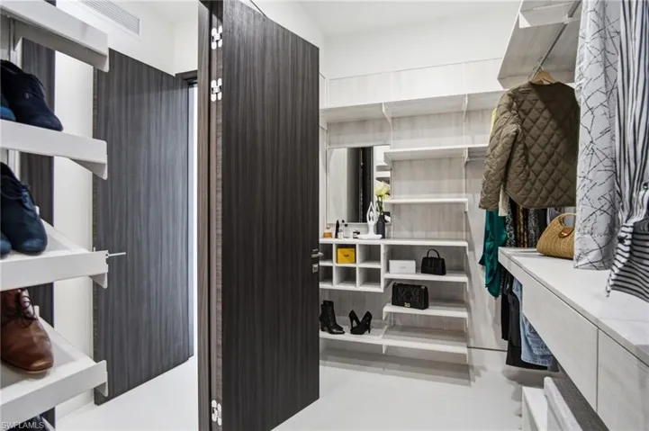 Customizable closet system featuring extensive shelving, hanging space, and integrated cubbies