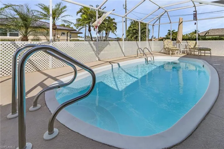 View of pool featuring a patio area and a lanai