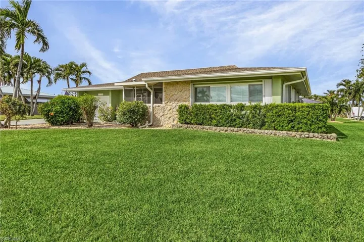 Single story home with a one year old roof, gutters and fully hurricane protection with all accordian shutters