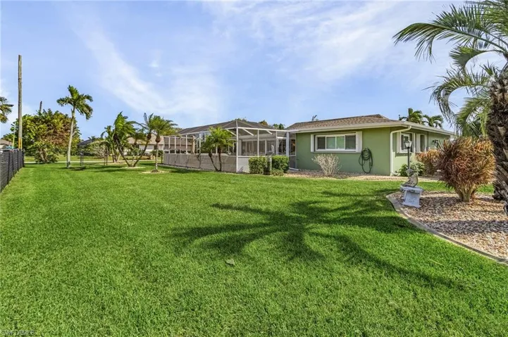 View of yard with a lanai