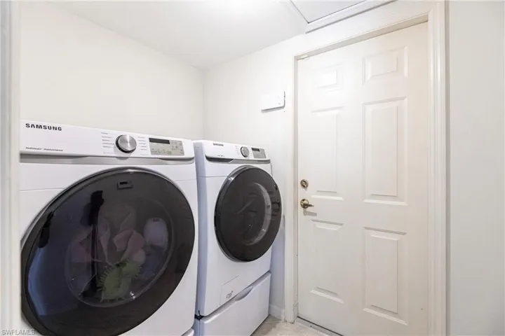 Laundry Room featuring washer and clothes dryer