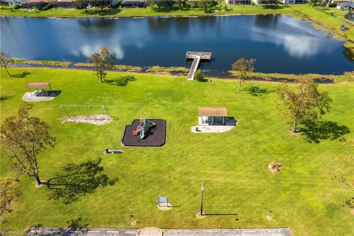 Drone / aerial view Community LAke featuring a water view