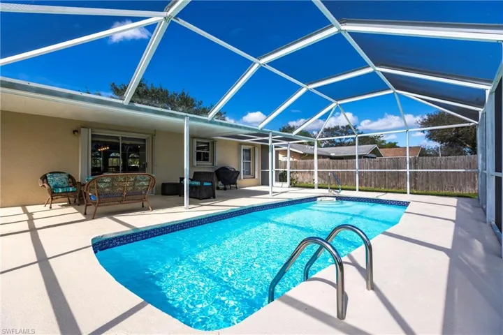 View of pool with a lanai area and a lanai