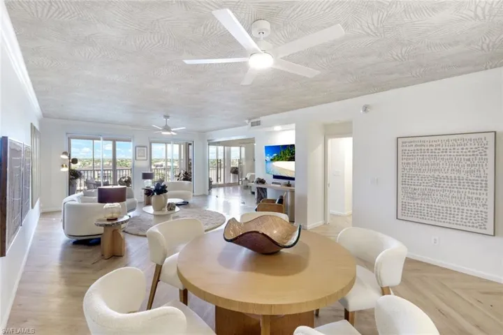Reimagined, great room and dining room with cutting edge ceiling Treatment