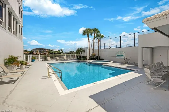 Oversized swimming pool and spa with outdoor kitchen
