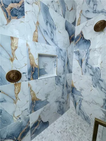 Bathroom view of a marble finish shower