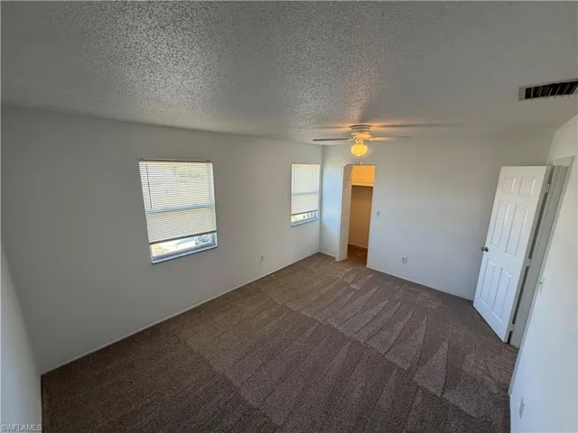 bedroom 1 with walk in closet