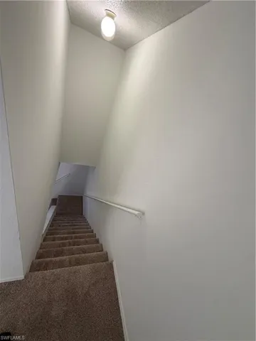 Stairway with a textured ceiling