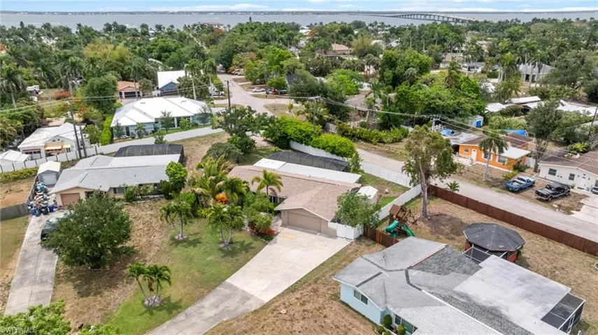 Aerial view of residential area with a notable bridge